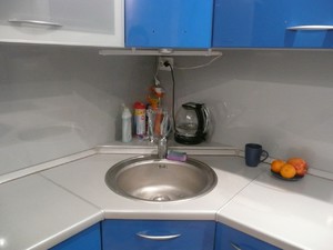 Врезная угловая мойка